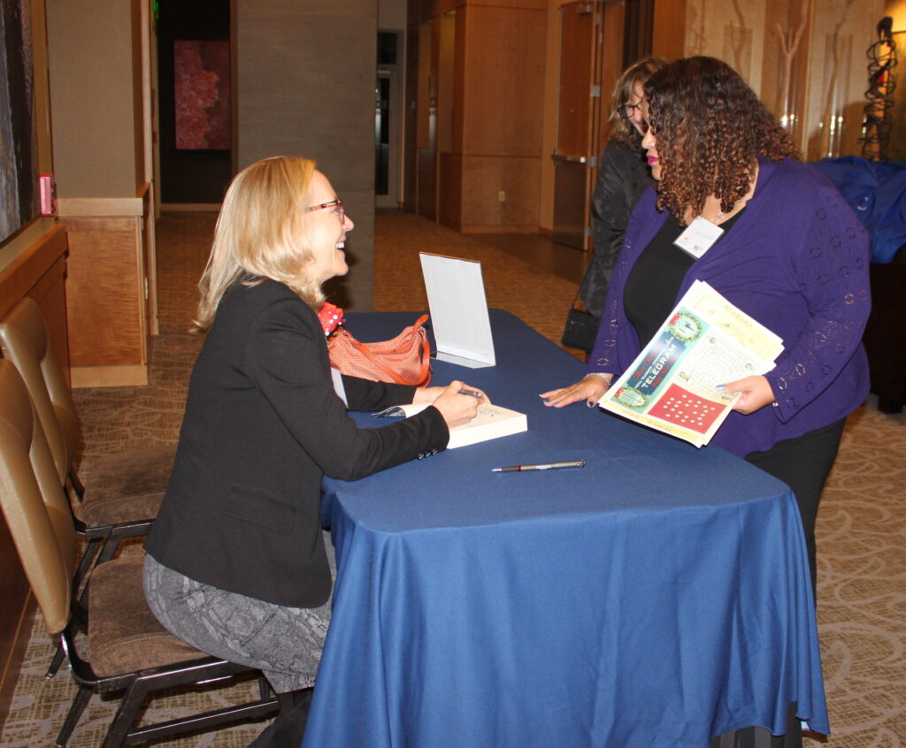2022 C&C Author Liza Mundy signs her book for guests