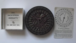 Cipher items donated to the Foundation by Dr. David Kahn, including an early DES encryption chip from 1978 encased in acrylic (at the time this chip was referred to as the world’s smallest computer).