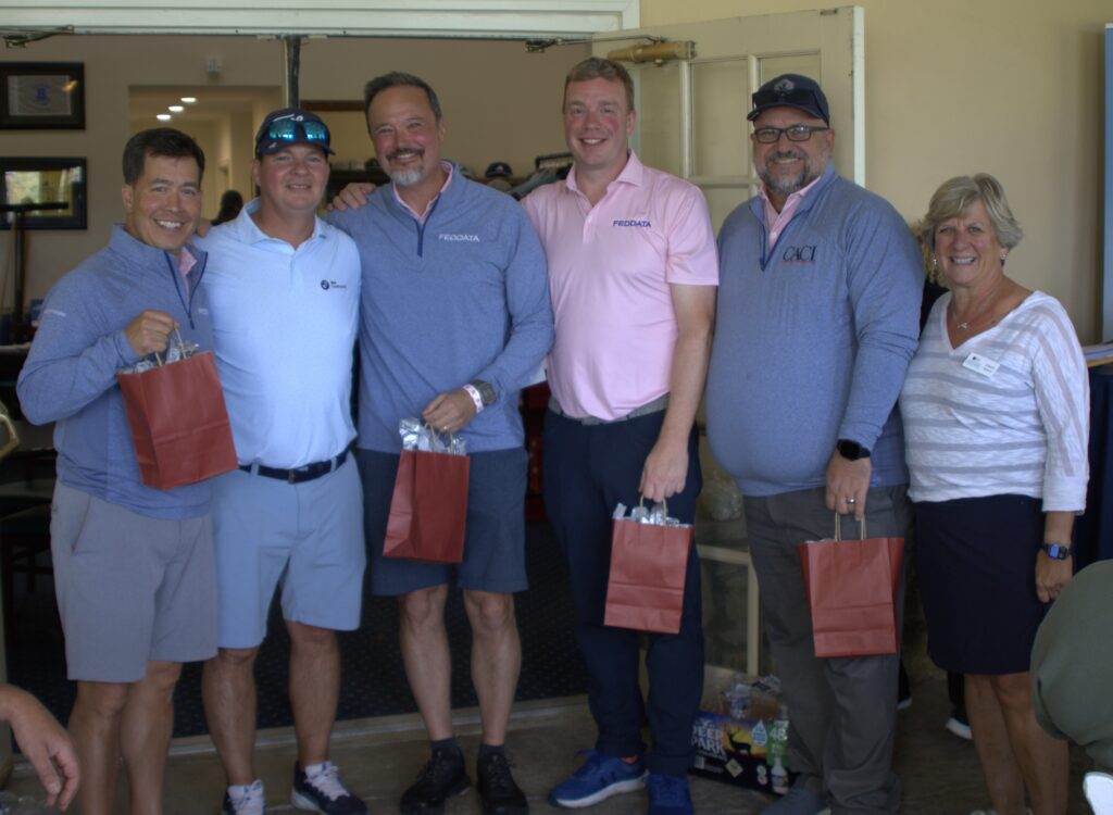2025 First Place Team - Allen Huevel, Rick Hardy, Wayne Schmidt, and John Gelsinger representing FedData/Dell Team #1 (pictured with Jim Millette (GDIT) and Laura Nelson (NCF)
