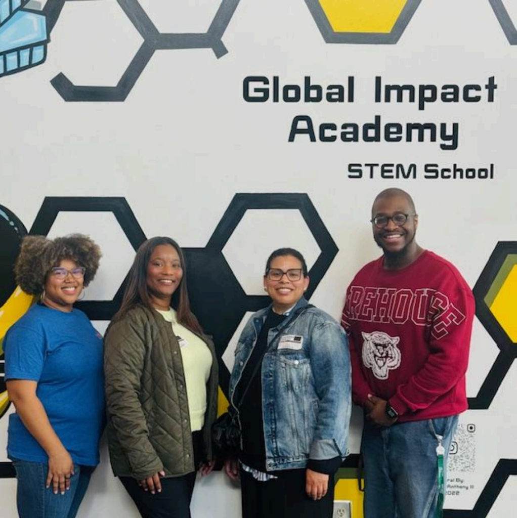 Members of the NCF Education Team visit with educators and students at Global Impact Academy STEM Magnet School in Georgia.