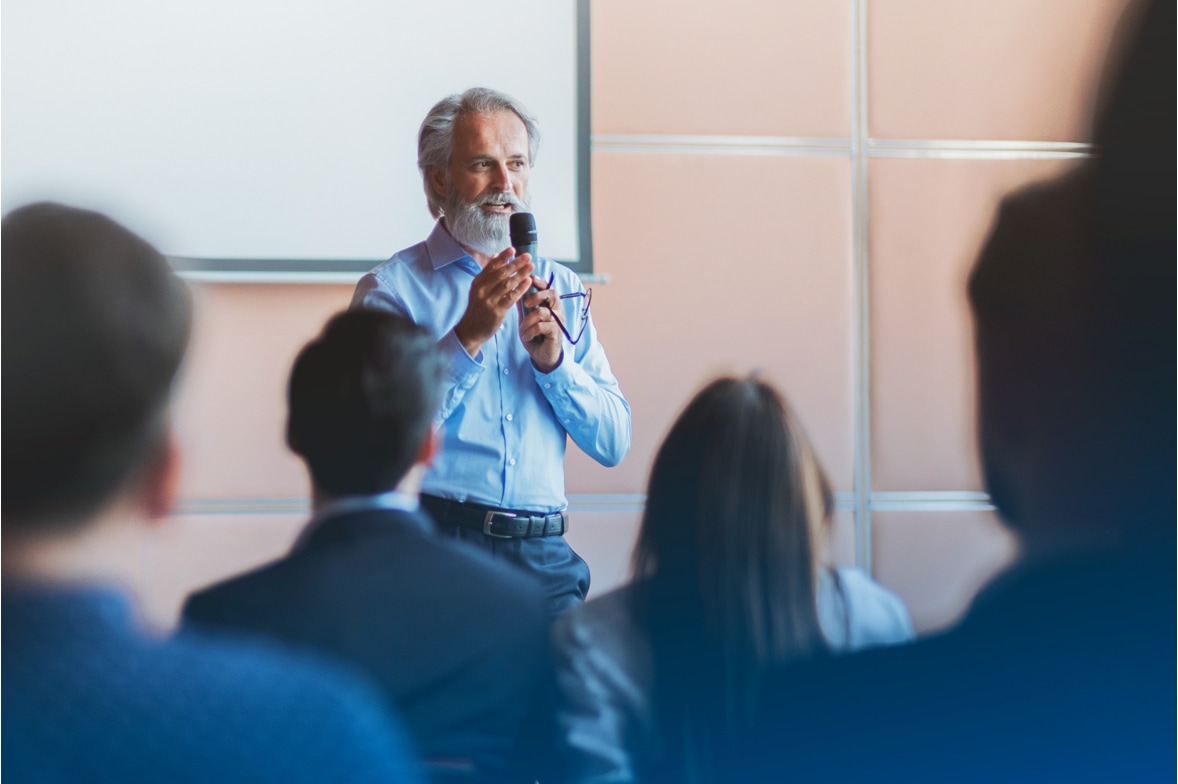 man speaking to young adult audience