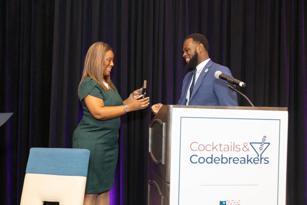 2024 Cocktails and Codebreakers - Educator Award for Mr. Derrick Harrell - presented by NCF Education Director Alisha Jordan.