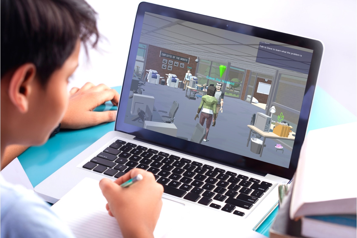 student playing educational computer game on laptop