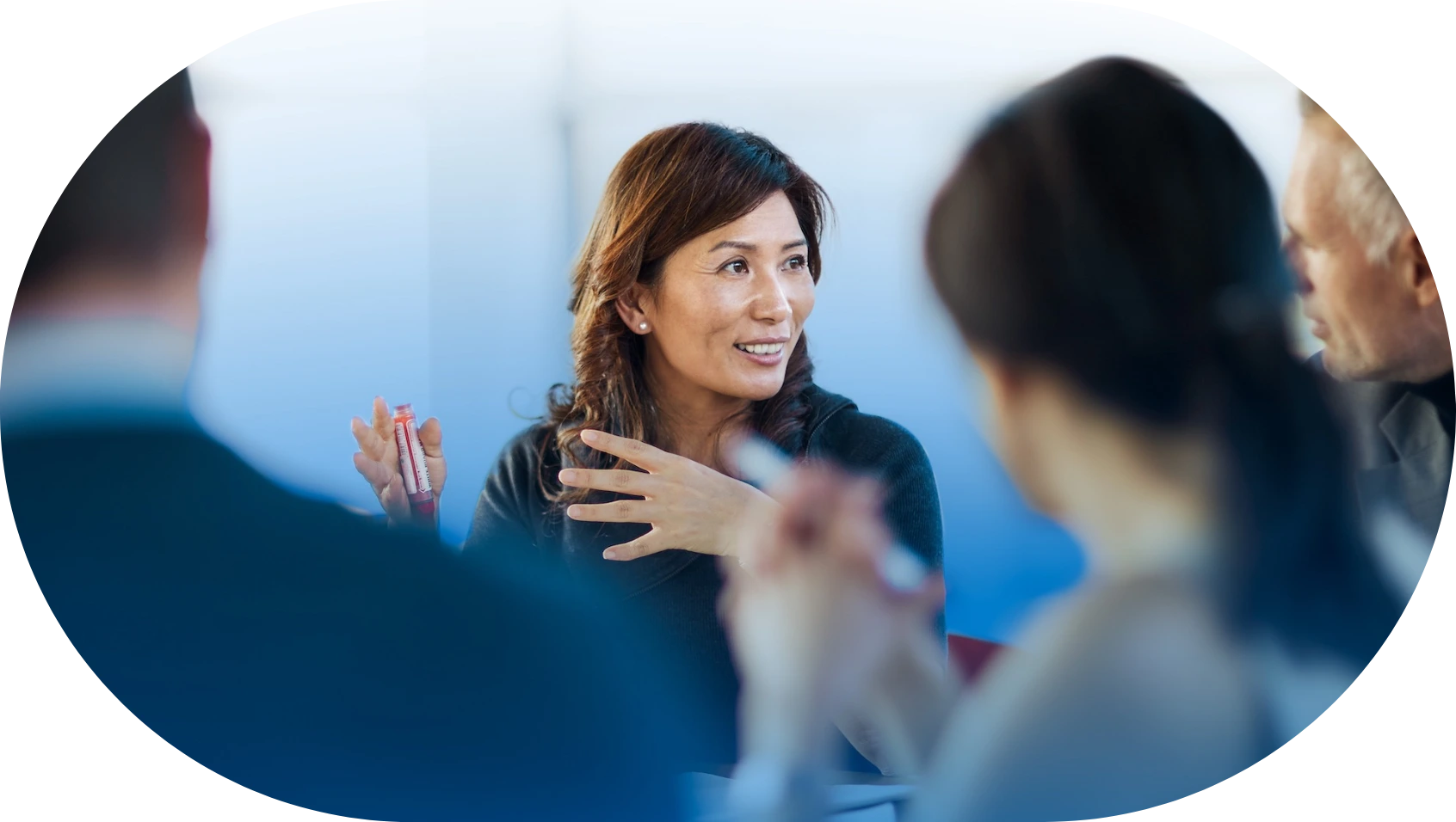 professional woman speaking in team discussion frame 2@2x